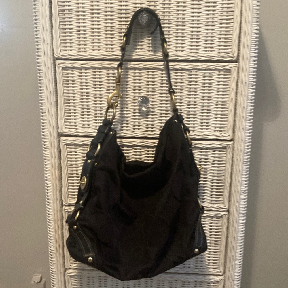 Coach hand bag w/storage bag.